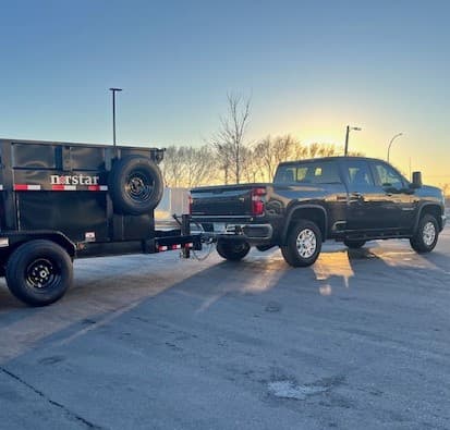 Truck with a dumpster trailer